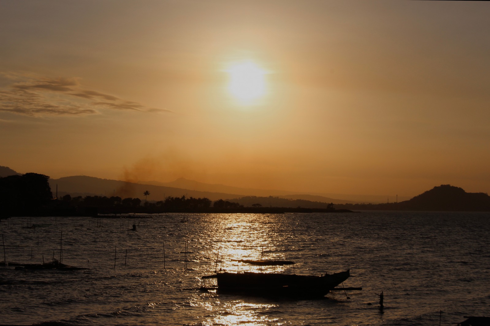 Laguna de Bay with a boat on a sunset setting